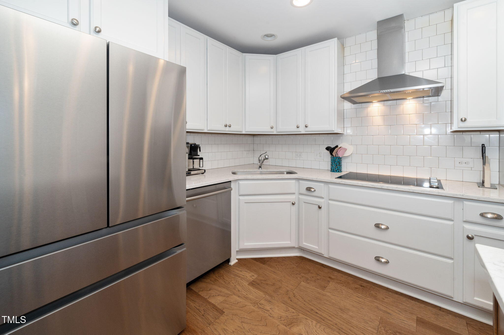 501 North Person Street, Unit 107 Raleigh, NC 27601 - Photo 12 of 30 a kitchen with a refrigerator sink stove and cabinets