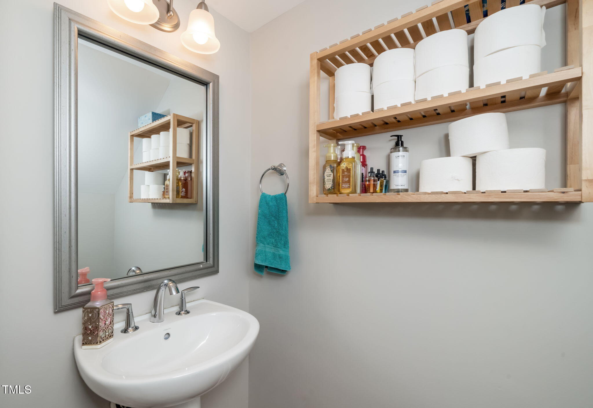 501 North Person Street, Unit 107 Raleigh, NC 27601 - Photo 13 of 30 a bathroom with a sink and mirror