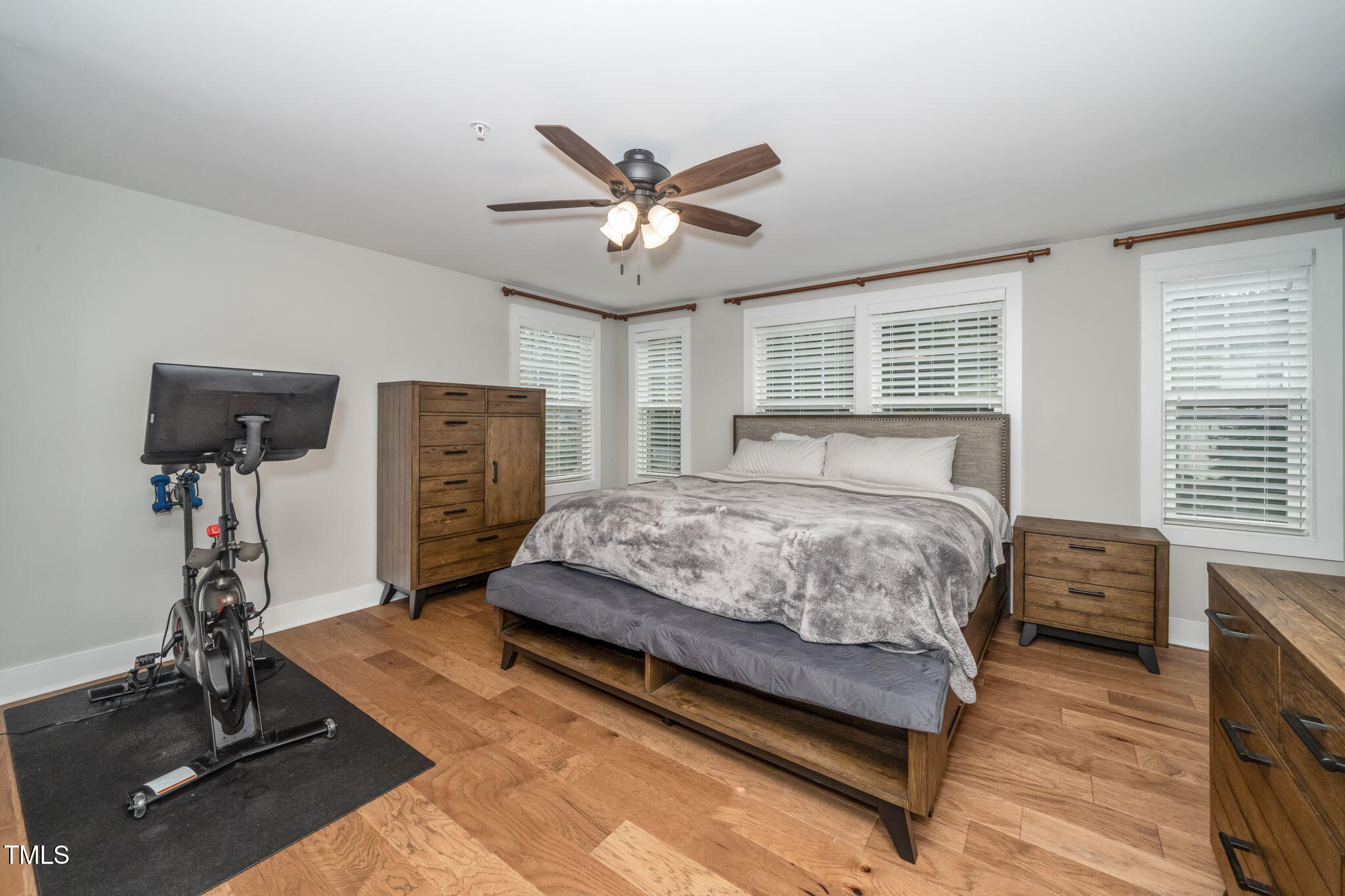 501 North Person Street, Unit 107 Raleigh, NC 27601 - Photo 16 of 30 a bedroom with a bed and a desk