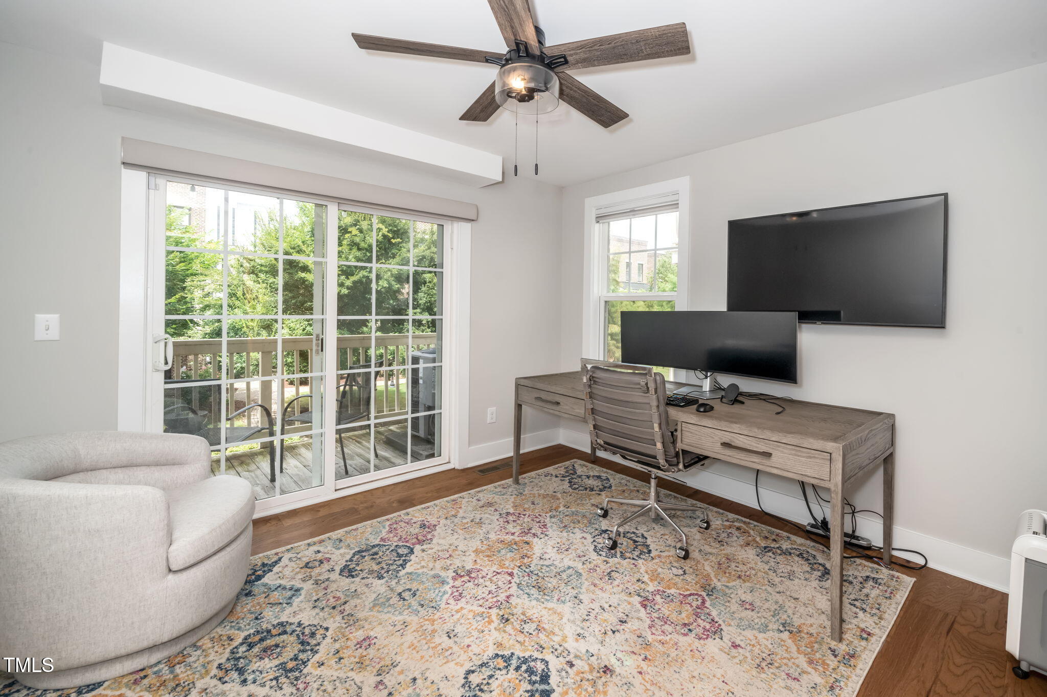 501 North Person Street, Unit 107 Raleigh, NC 27601 - Photo 22 of 30 a living room with furniture and a flat screen tv
