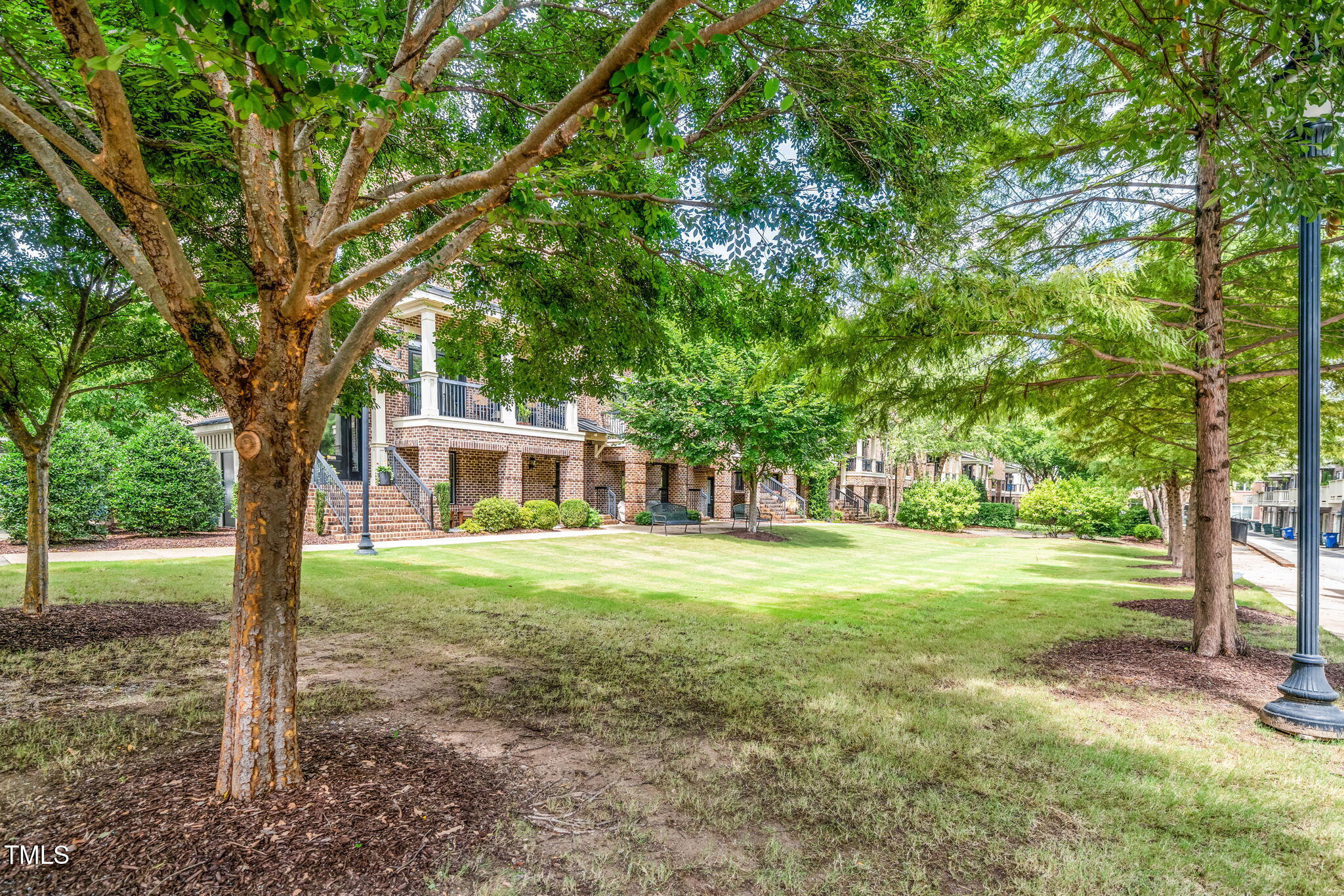 501 North Person Street, Unit 107 Raleigh, NC 27601 - Photo 30 of 30 a view of a house with a yard
