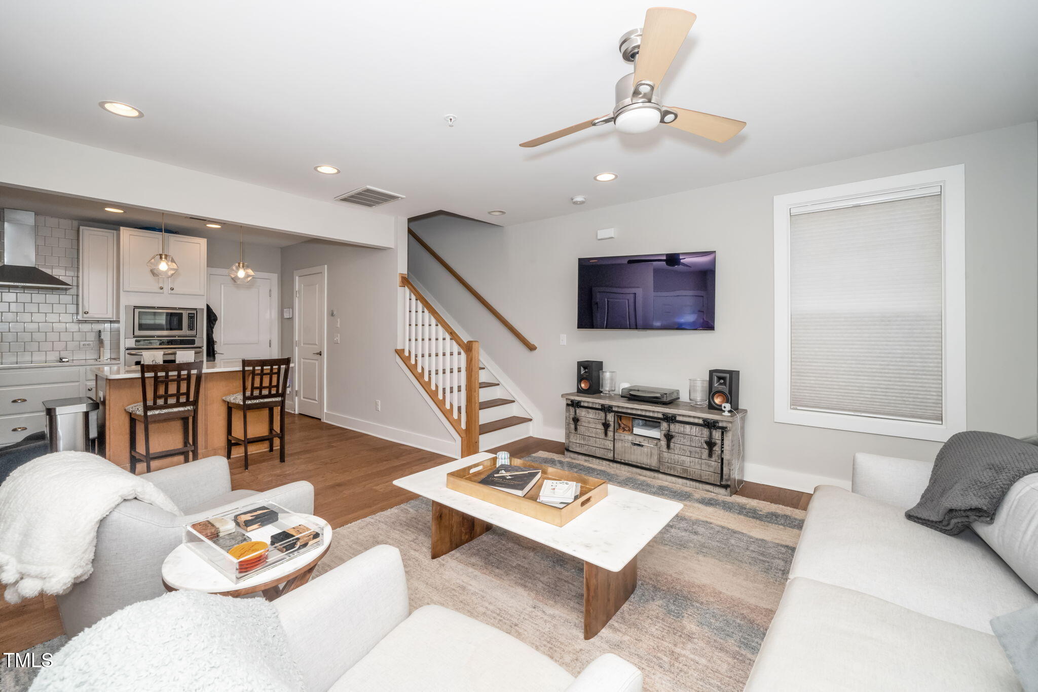 501 North Person Street, Unit 107 Raleigh, NC 27601 - Photo 6 of 30 a living room with furniture and view of kitchen