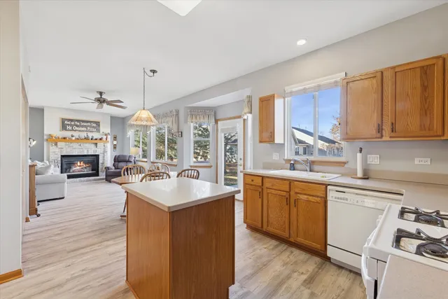 a kitchen with sink cabinets and wooden floor