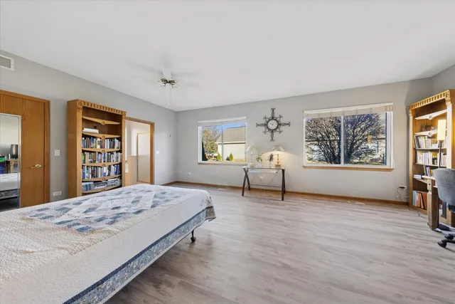 a spacious bedroom with a large bed and a window