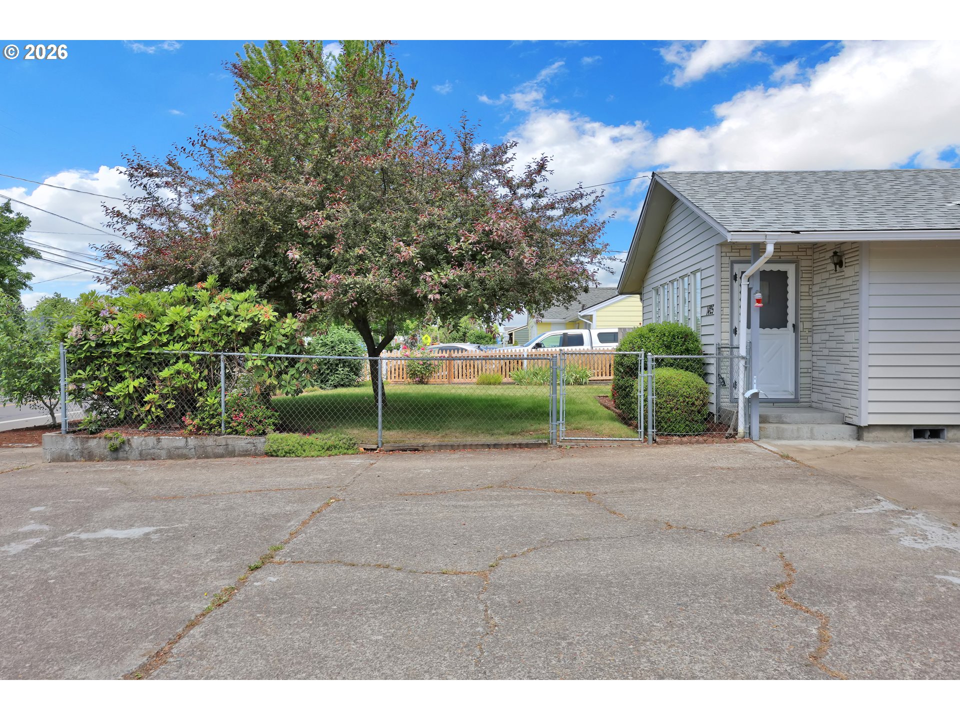 1425 Taney Street Eugene, OR 97402 - Photo 23 of 34 a view of a house with a yard and a garage