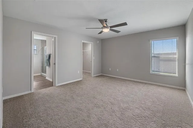 a bathroom with a glass shower door