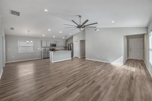 a view of a kitchen with microwave and cabinets