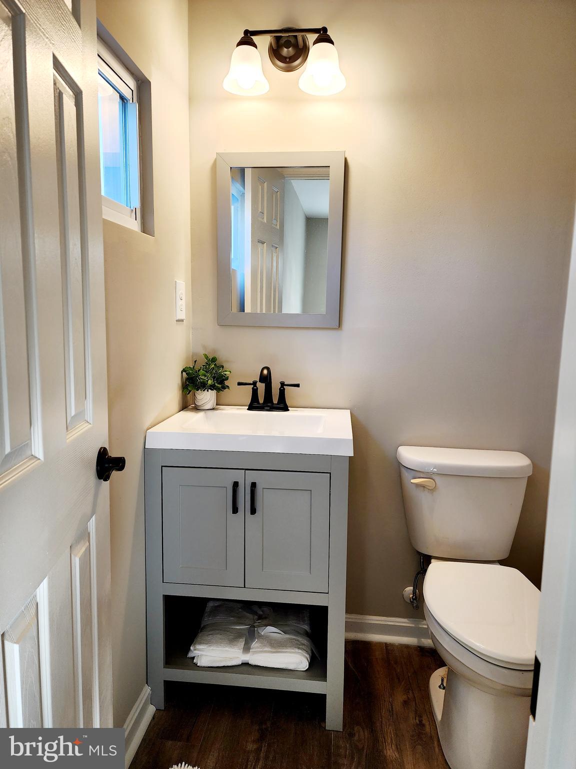 475 Bafford Road Lusby, MD 20657 - Photo 16 of 21 a bathroom with a sink toilet and mirror
