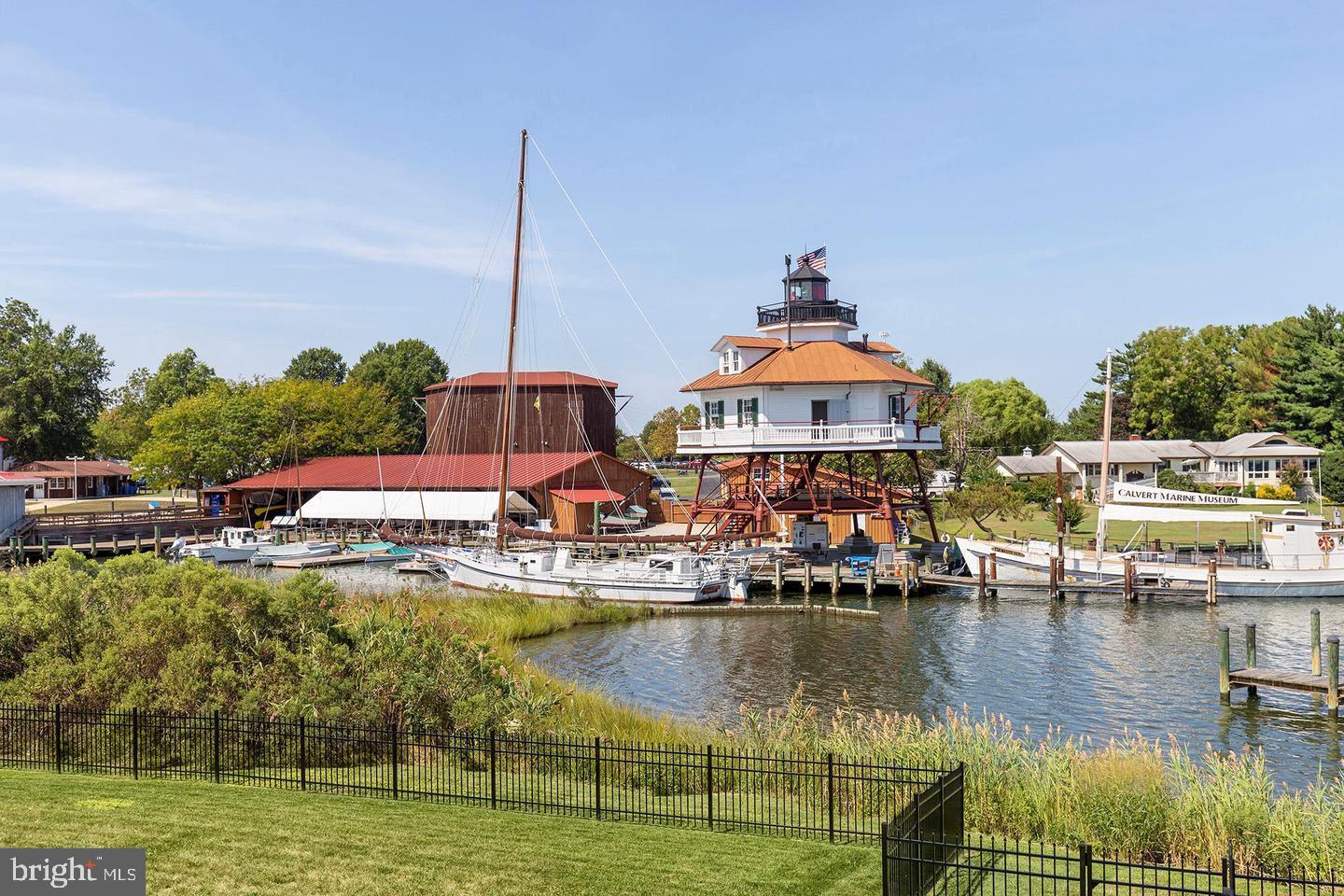 475 Bafford Road Lusby, MD 20657 - Photo 20 of 21 a view of a lake with a house swimming pool and outdoor space