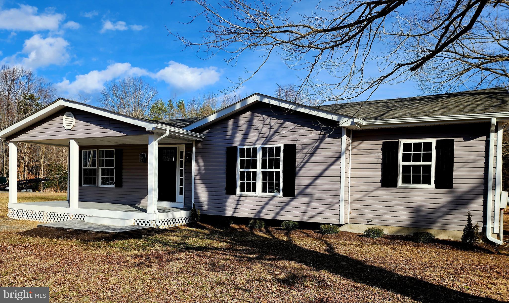 475 Bafford Road Lusby, MD 20657 - Photo 3 of 21 a front view of a house with a garden