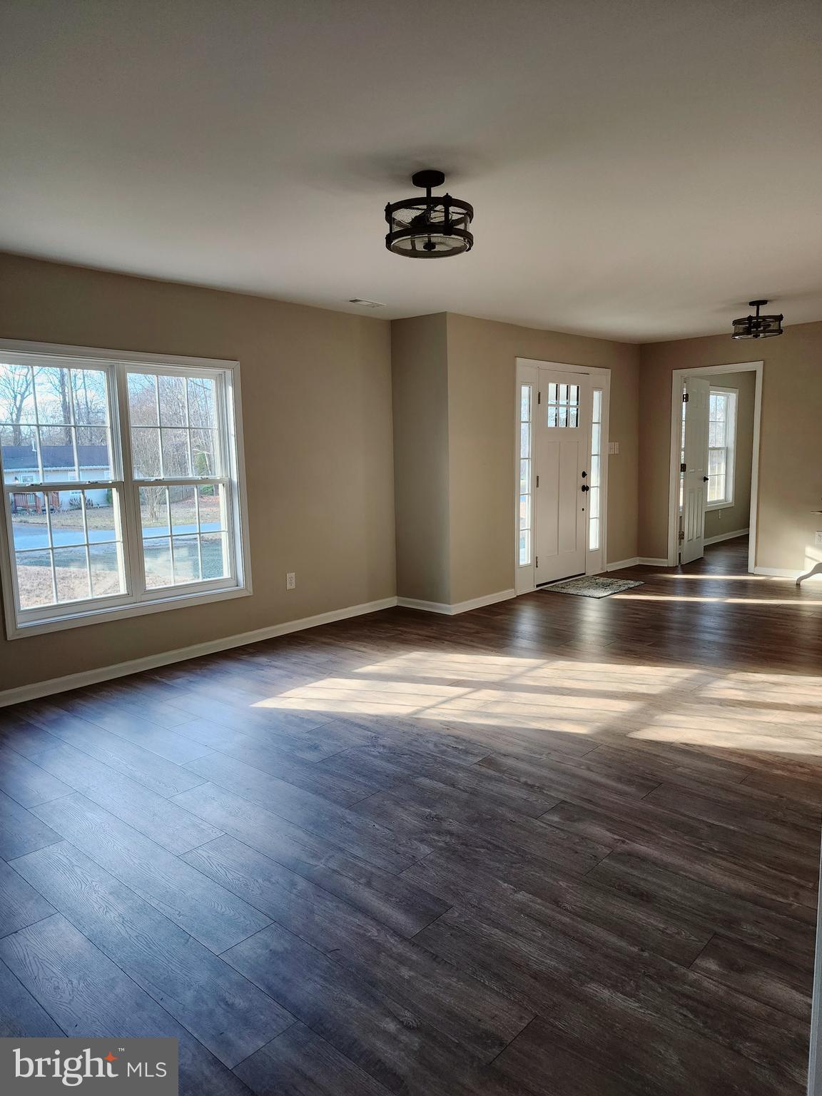 475 Bafford Road Lusby, MD 20657 - Photo 9 of 21 an empty room with wooden floor and windows