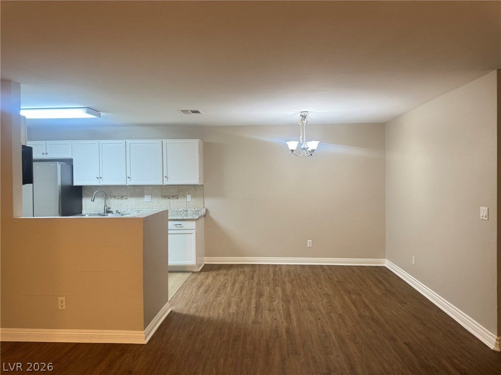 5141 South Lindell Road, Unit 102 Las Vegas, NV 89118 - Photo 7 of 17 An open concept design seamlessly connects the efficient kitchen with the adjacent dining area.