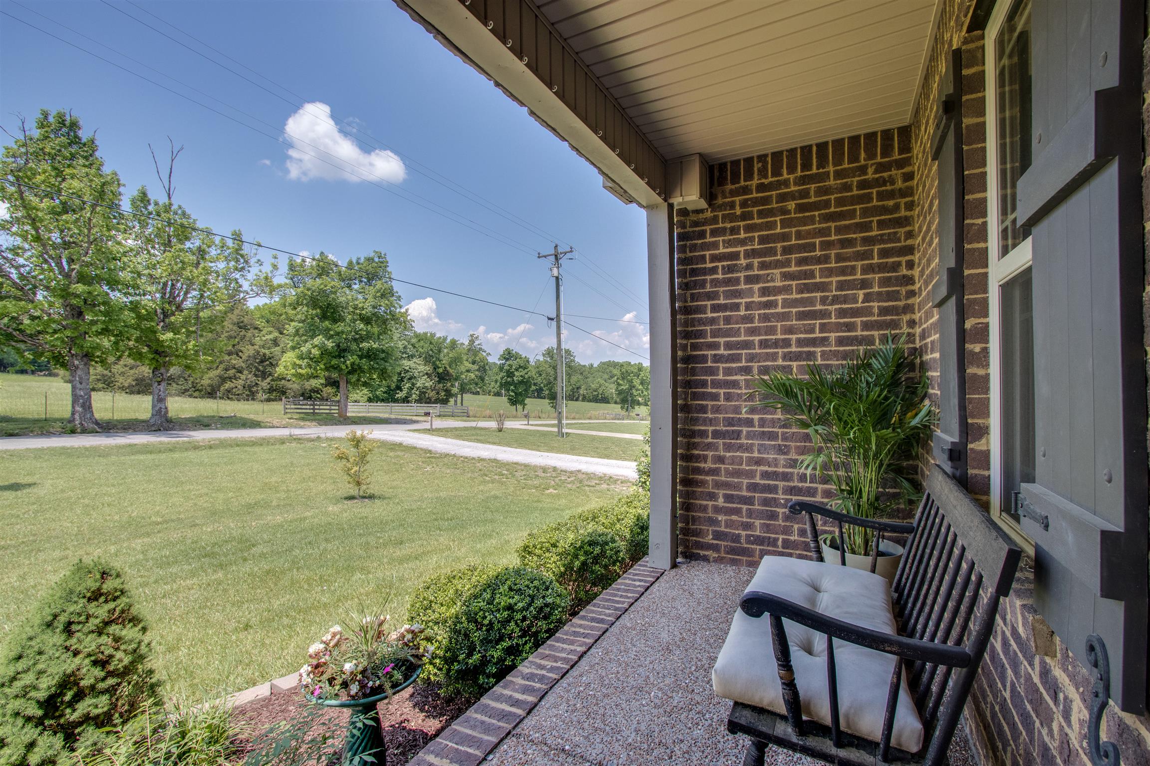 719 Sugar Flat Road Lebanon, TN 37087 - Photo 3 of 30 a view of a chair and tables front of the house