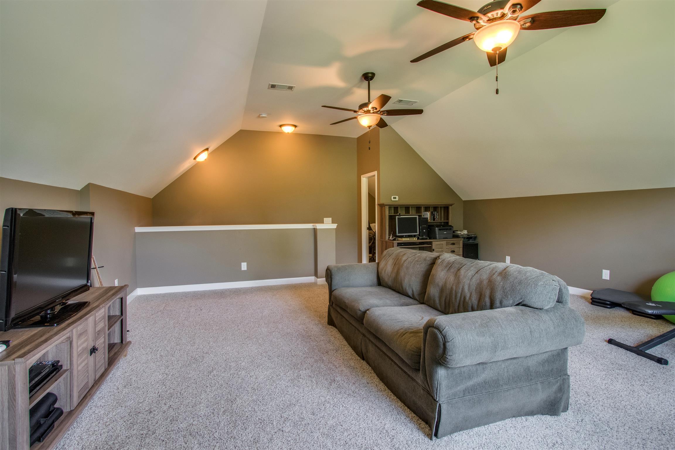719 Sugar Flat Road Lebanon, TN 37087 - Photo 22 of 30 a living room with furniture and a flat screen tv