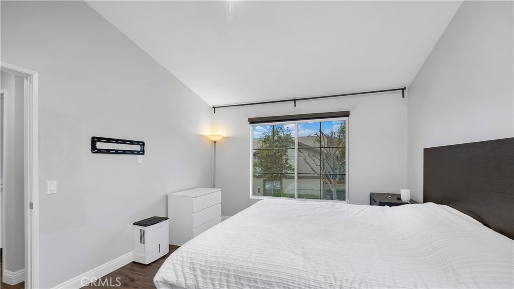 250 Chaumont Circle Lake Forest, CA 92610 - Photo 12 of 28 a bedroom with a bed and a window