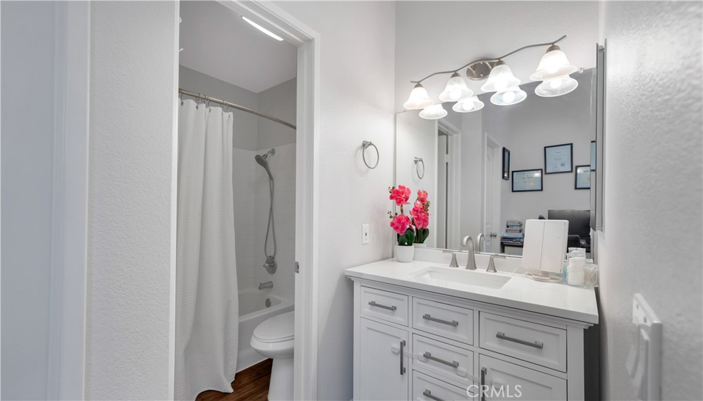 250 Chaumont Circle Lake Forest, CA 92610 - Photo 13 of 28 a bathroom with a sink vanity and a mirror