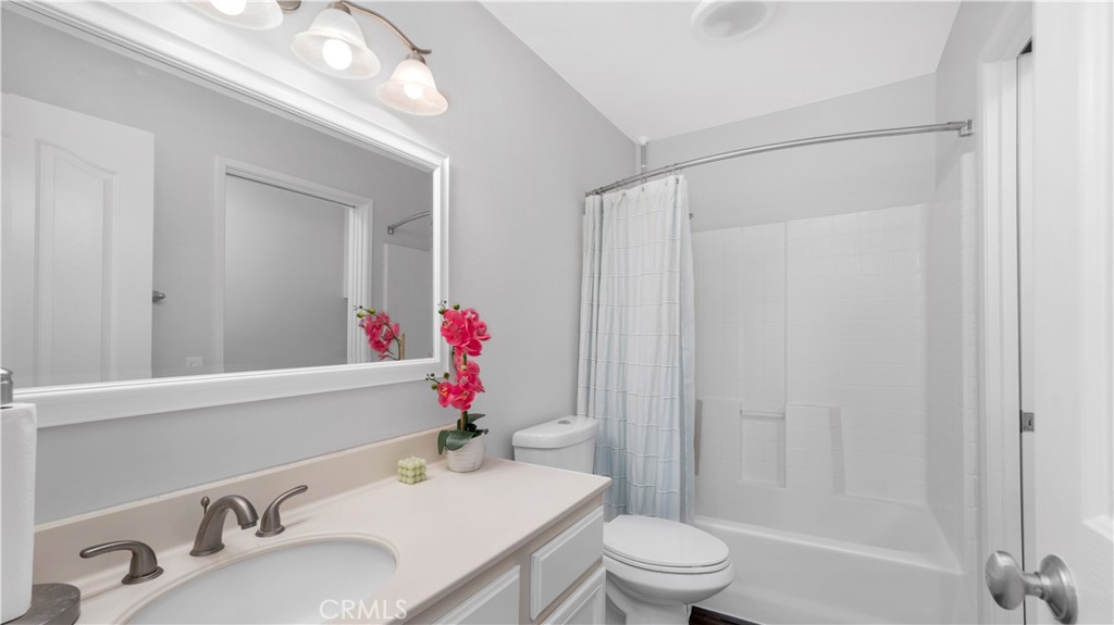 250 Chaumont Circle Lake Forest, CA 92610 - Photo 17 of 28 a bathroom with a sink vanity mirror and toilet