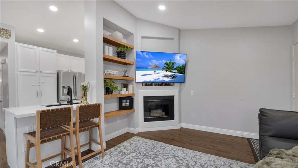 250 Chaumont Circle Lake Forest, CA 92610 - Photo 5 of 28 a living room with furniture flat screen tv and a fireplace