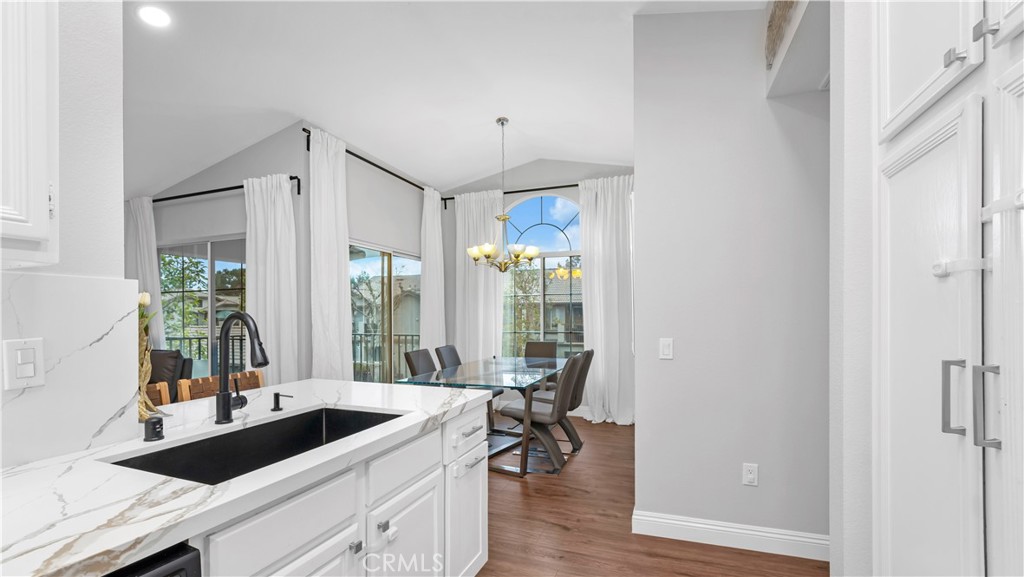 250 Chaumont Circle Lake Forest, CA 92610 - Photo 8 of 28 a view of a kitchen from a living room