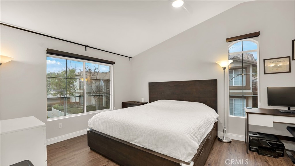 250 Chaumont Circle Lake Forest, CA 92610 - Photo 10 of 28 a bedroom with a bed and a flat tv screen on the dresser