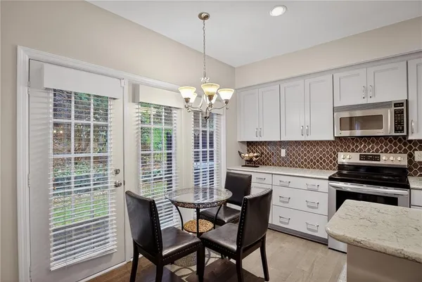 a kitchen that has a cabinets and a stove