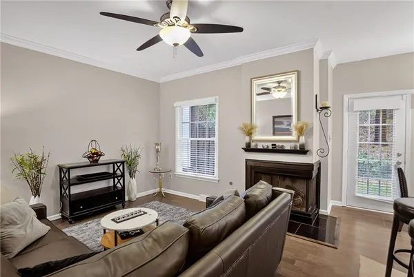 a living room with furniture and a fireplace