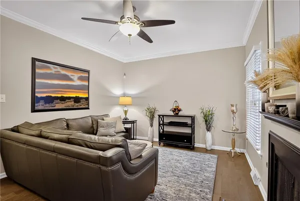 a living room with furniture and a fireplace