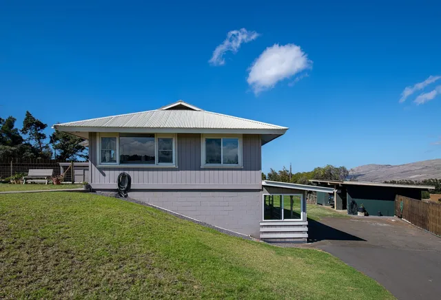a view of a house with a yard porch and sitting area