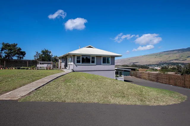 a swimming pool view with a seating space