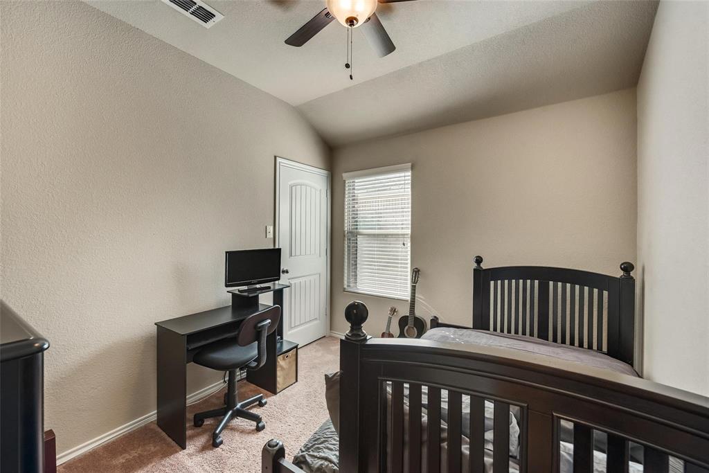 649 Clearbrook Street Azle, TX 76020 - Photo 25 of 28 a bedroom with furniture and a window