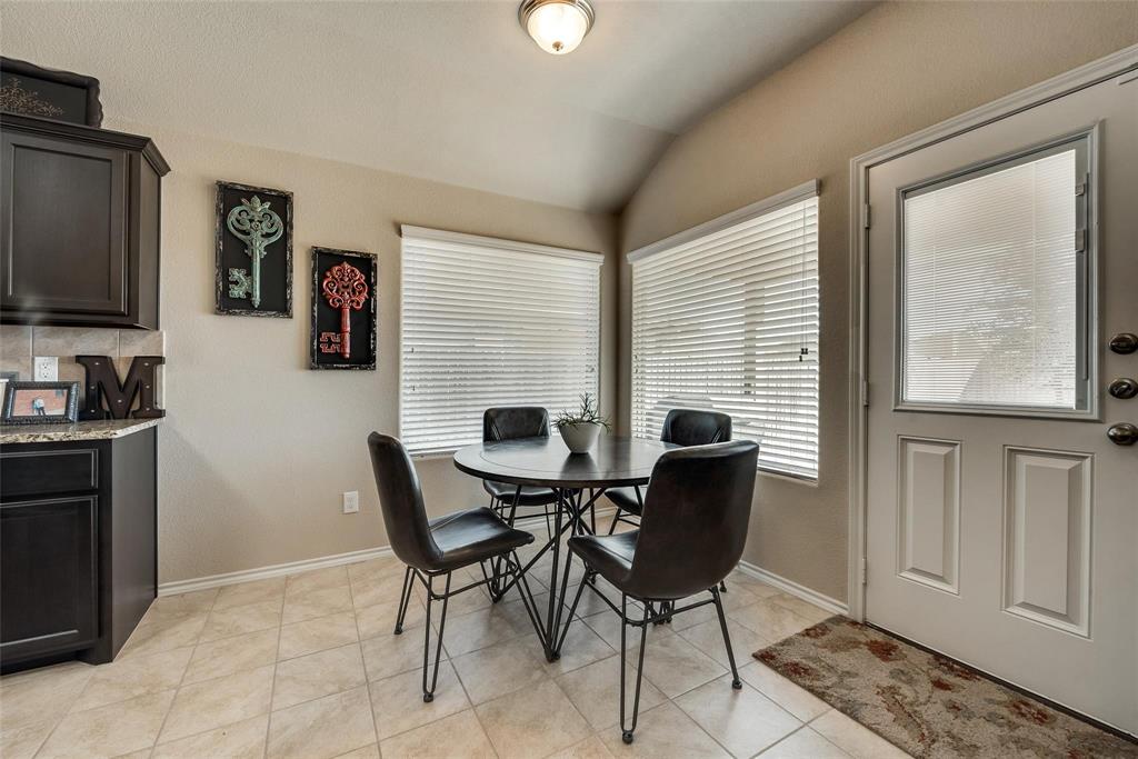 649 Clearbrook Street Azle, TX 76020 - Photo 9 of 28 a dining room with furniture and window