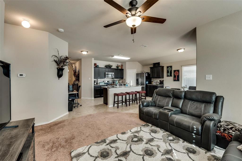 649 Clearbrook Street Azle, TX 76020 - Photo 10 of 28 a living room with furniture and kitchen view
