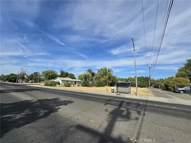 a view of a street with a building in the background