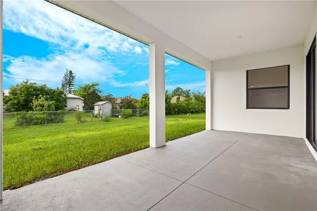 a view of a garden with an outdoor seating