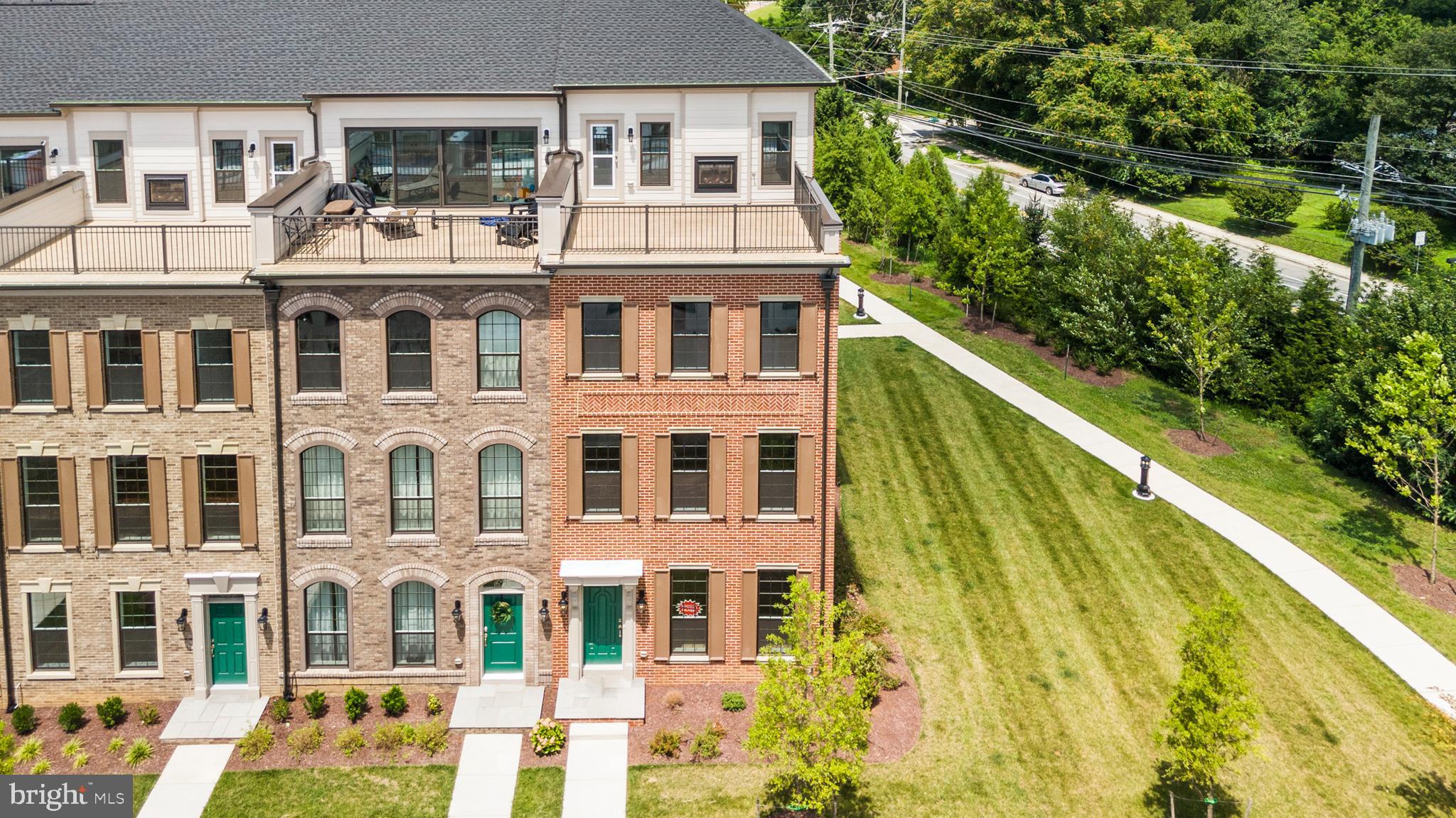 623 Trimaran Way Oxon Hill, MD 20745 - Photo 1 of 45 a front view of a residential apartment building with a yard