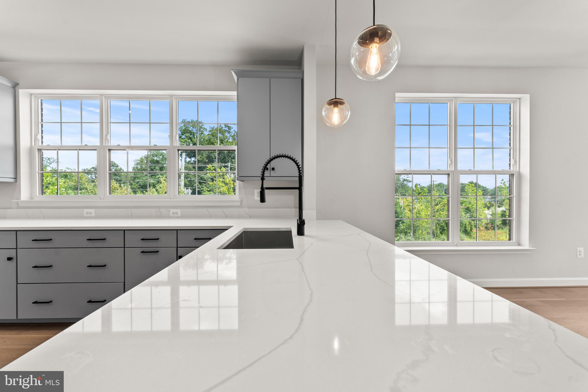 623 Trimaran Way Oxon Hill, MD 20745 - Photo 12 of 45 a kitchen with a large window and white cabinets
