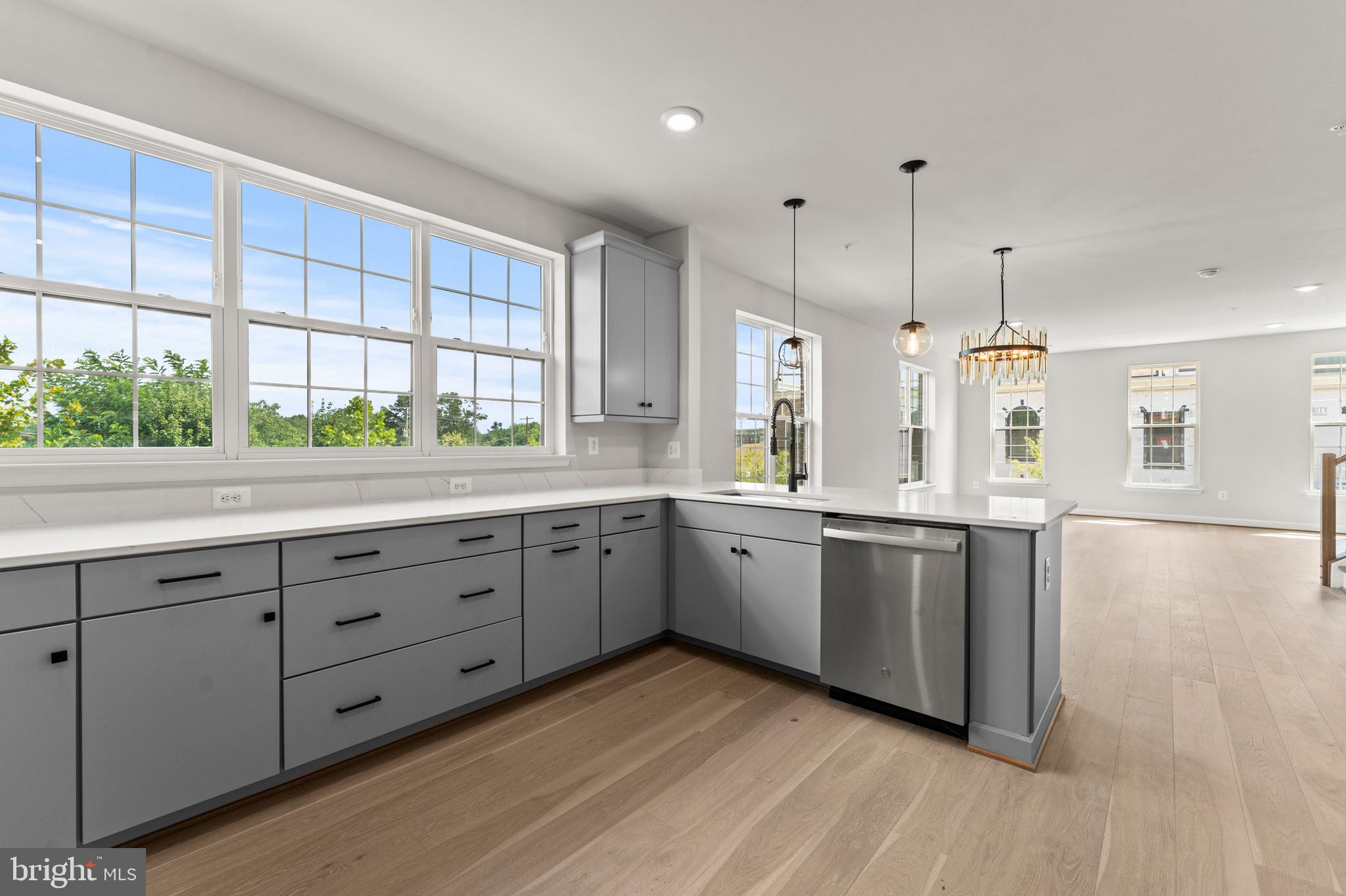 623 Trimaran Way Oxon Hill, MD 20745 - Photo 15 of 45 a kitchen with granite countertop white cabinets and window