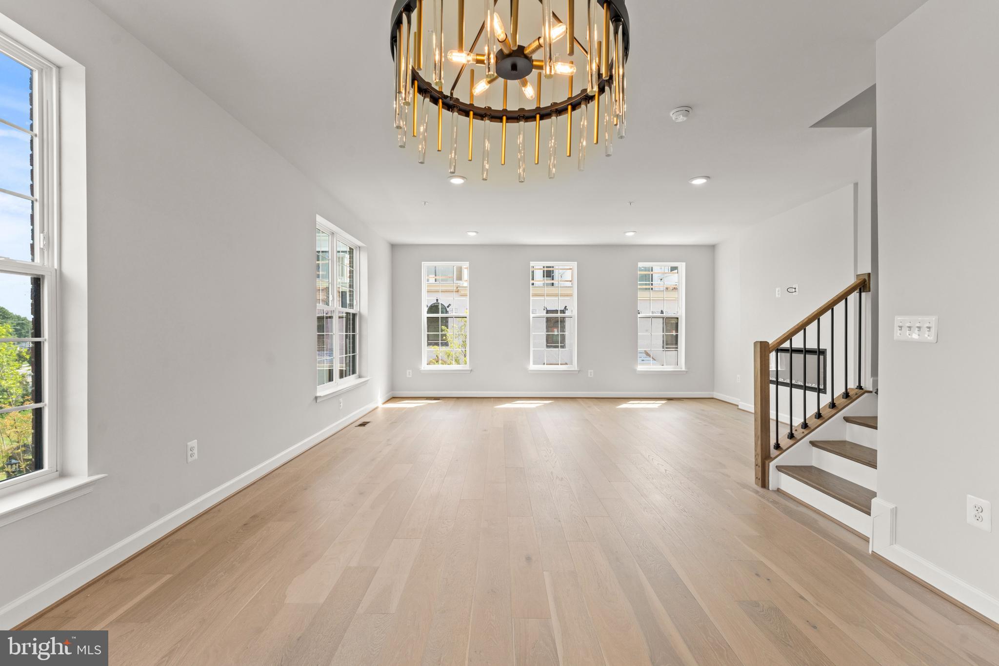 623 Trimaran Way Oxon Hill, MD 20745 - Photo 17 of 45 an empty room with wooden floor and windows