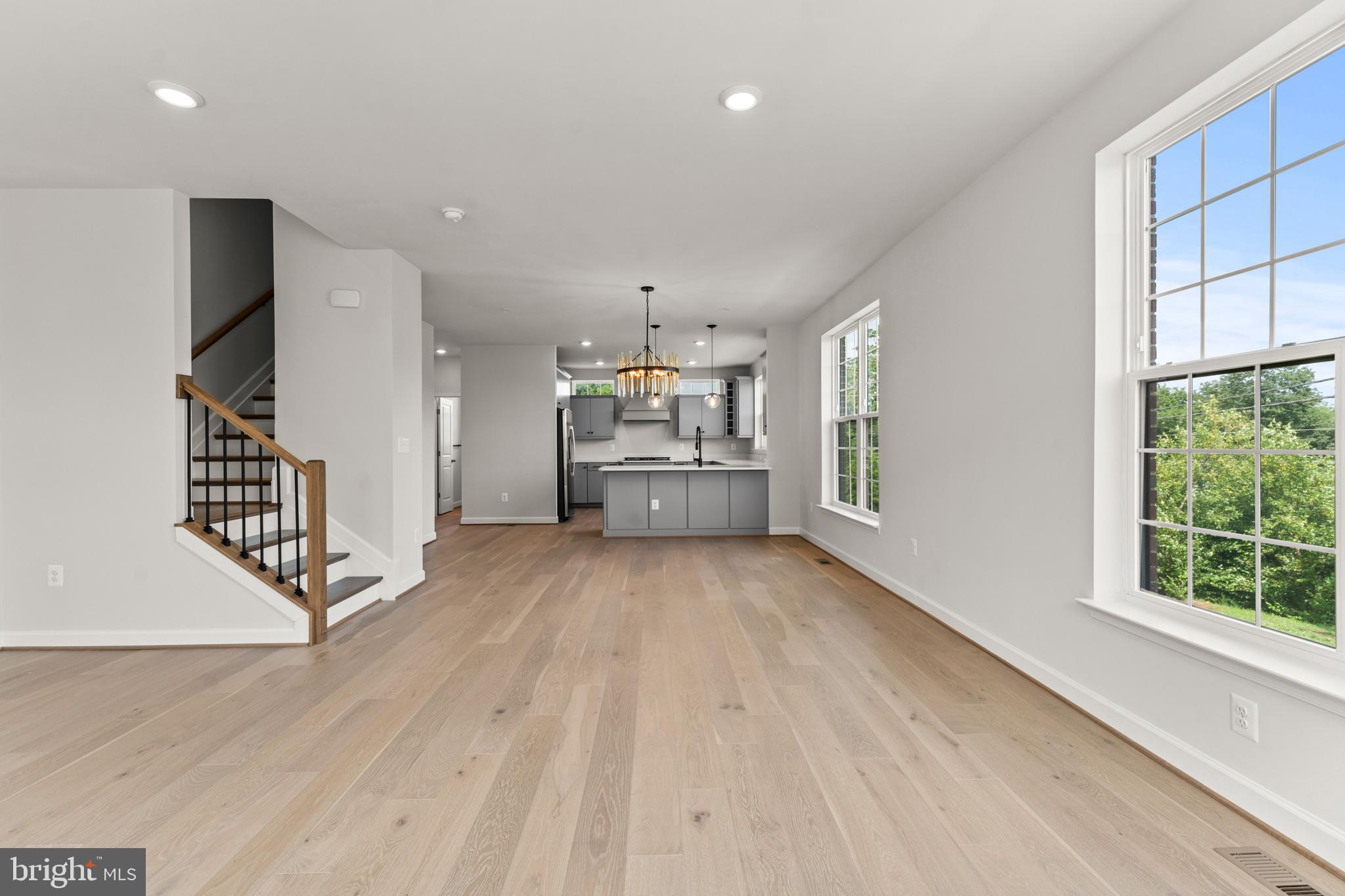 623 Trimaran Way Oxon Hill, MD 20745 - Photo 21 of 45 an empty room with wooden floor windows and staircase