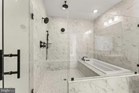 a bathroom with bathtub and vanity