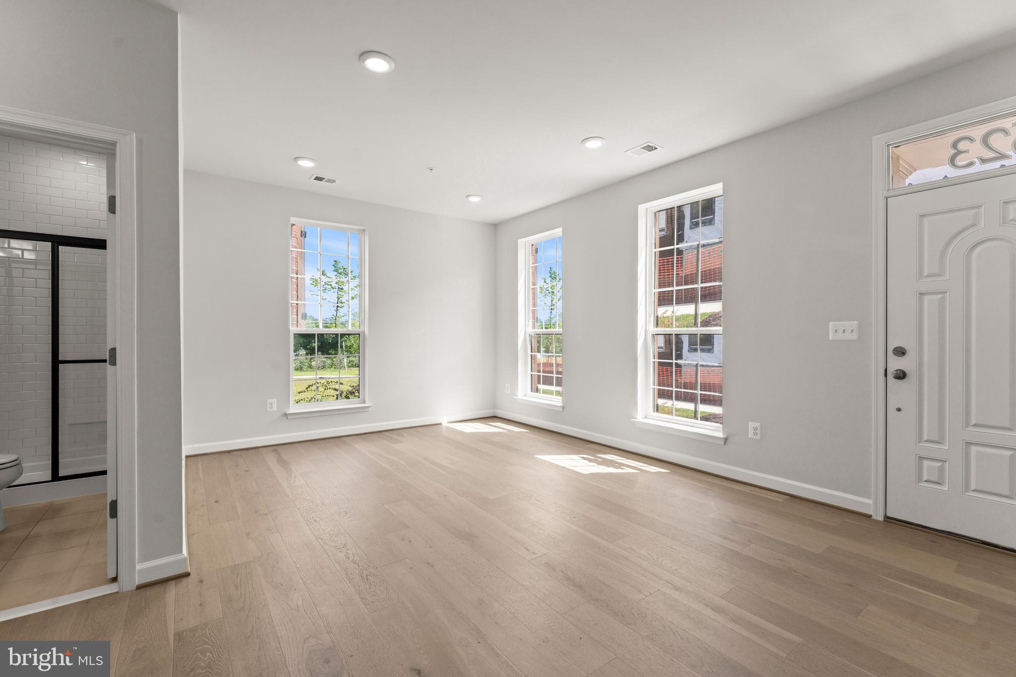 623 Trimaran Way Oxon Hill, MD 20745 - Photo 3 of 45 an empty room with wooden floor and windows