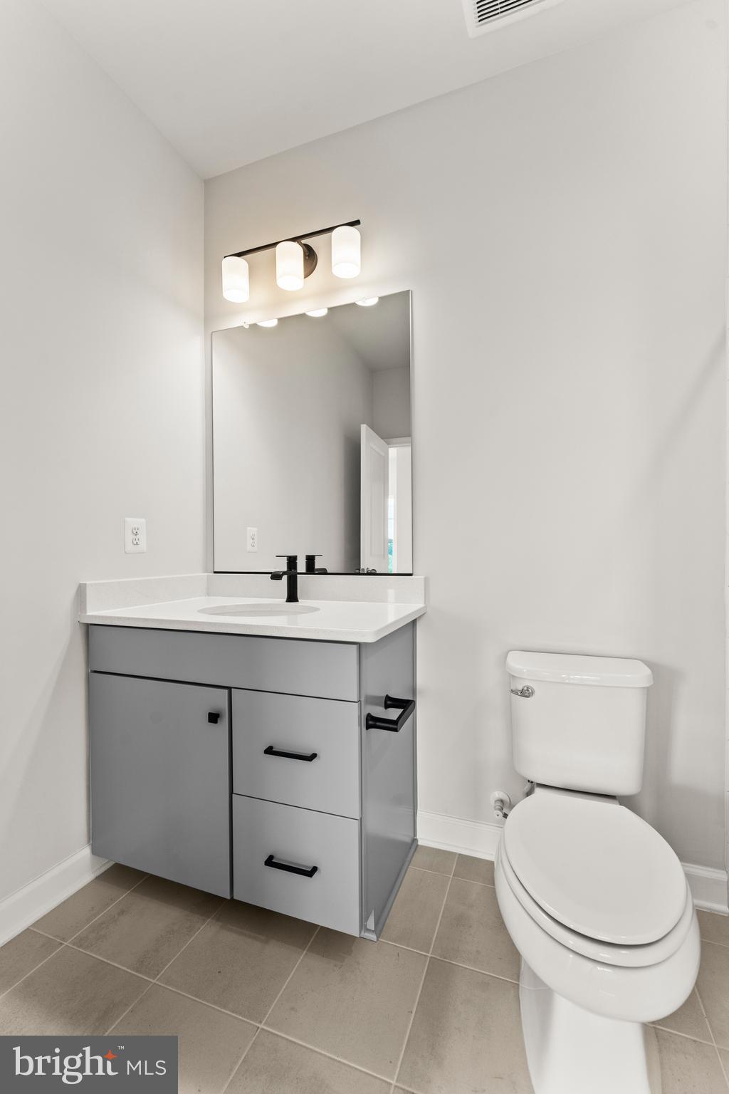 623 Trimaran Way Oxon Hill, MD 20745 - Photo 33 of 45 a bathroom with a toilet sink and mirror