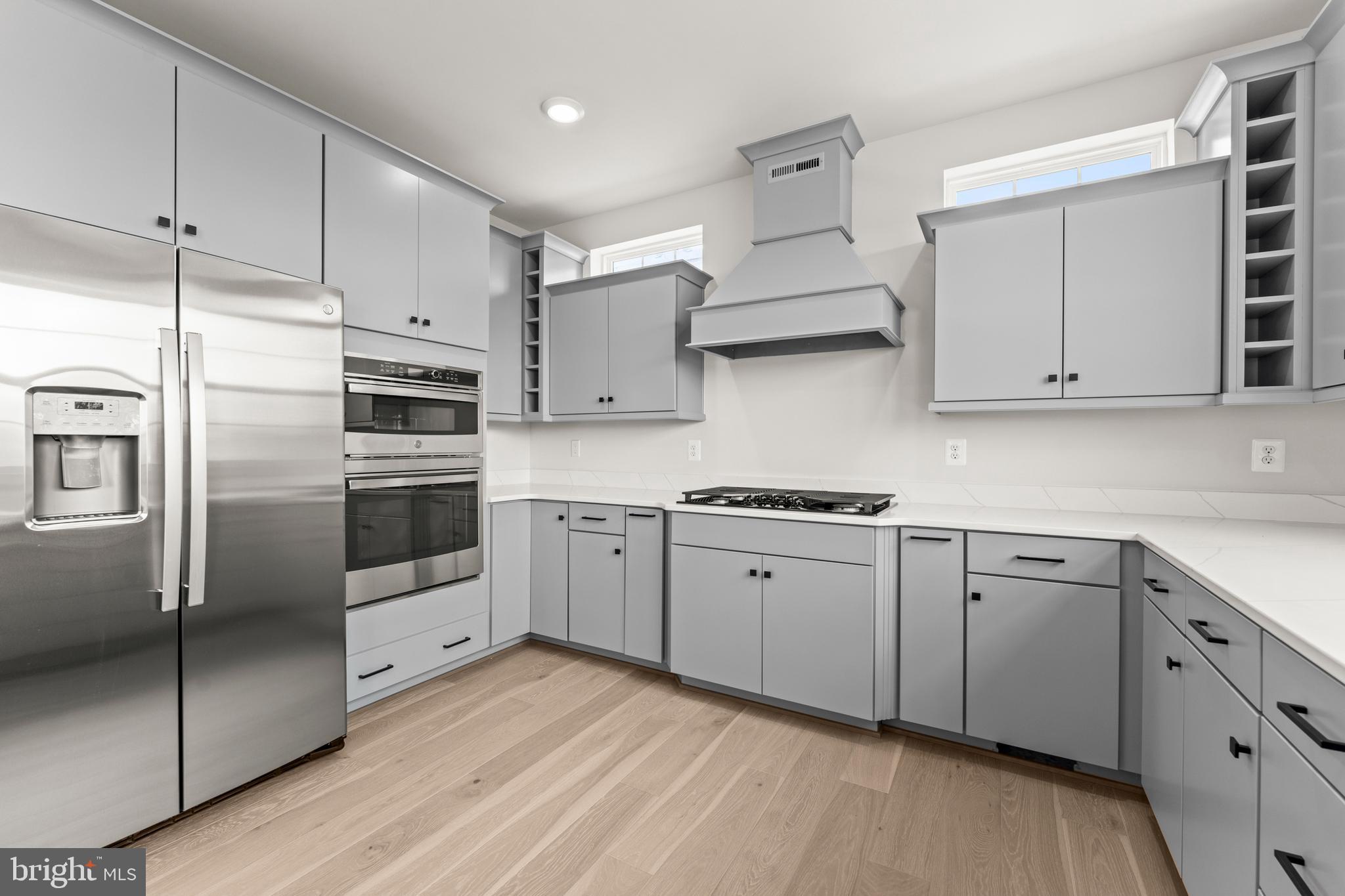 623 Trimaran Way Oxon Hill, MD 20745 - Photo 9 of 45 a kitchen with stainless steel appliances granite countertop a refrigerator and a stove top oven