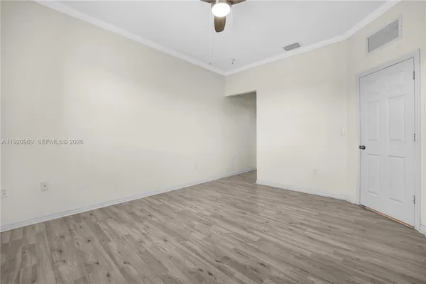 a white toilet sitting next to a shower
