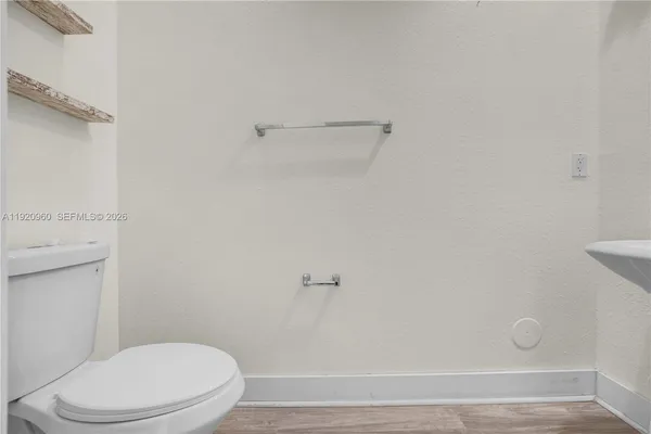 a bathroom with a sink a shower and a mirror