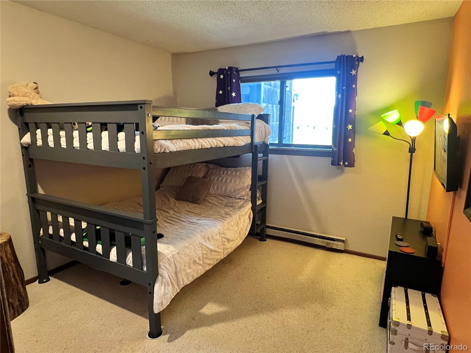 317 County Road 832, Unit 2412 Fraser, CO 80442 - Photo 11 of 17 a bedroom with bed and a window