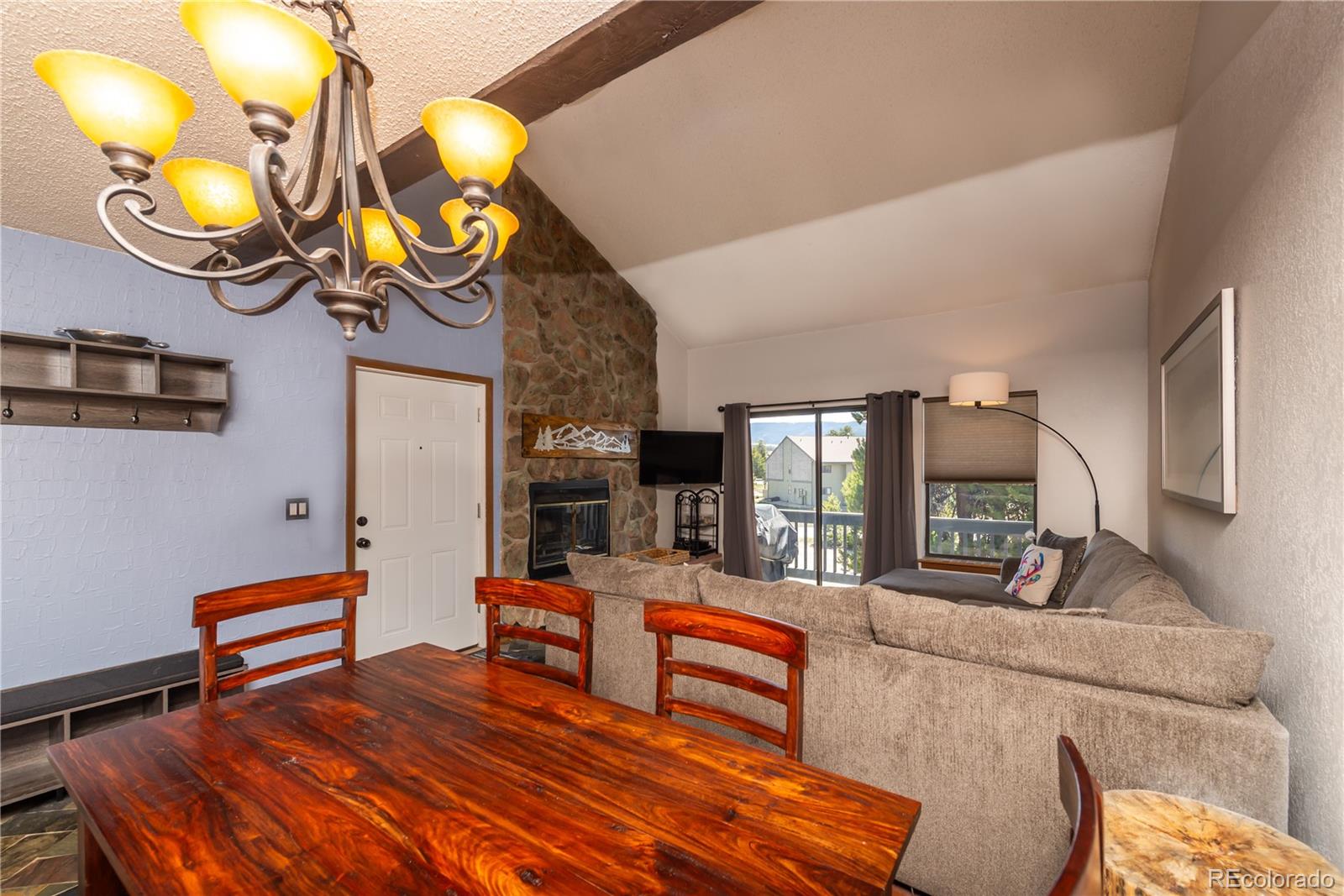 317 County Road 832, Unit 2412 Fraser, CO 80442 - Photo 5 of 17 a bedroom with furniture and a large mirror