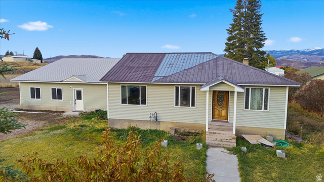 165 Main Street Georgetown, ID 83239 - Photo 39 of 50 Ranch-style house featuring a metal roof and a front yard