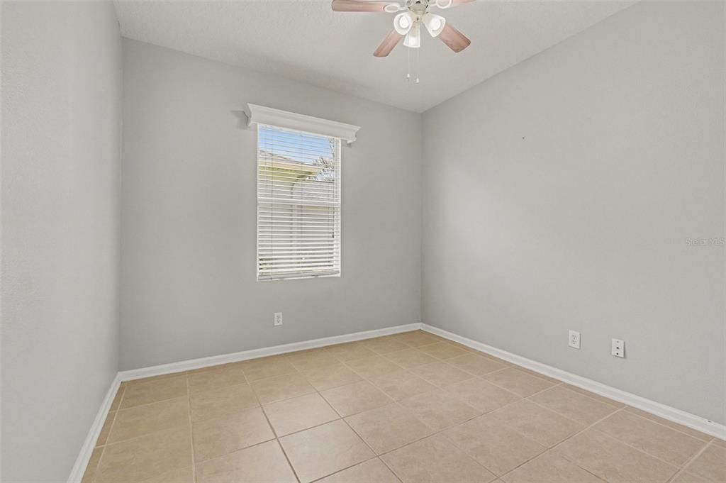 531 Cressa Circle Cocoa, FL 32926 - Photo 11 of 16 an empty room with a chandelier fan