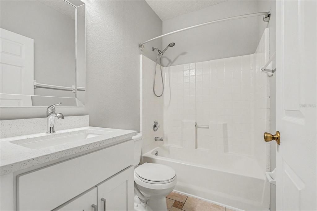 531 Cressa Circle Cocoa, FL 32926 - Photo 12 of 16 a bathroom with a sink a toilet and shower